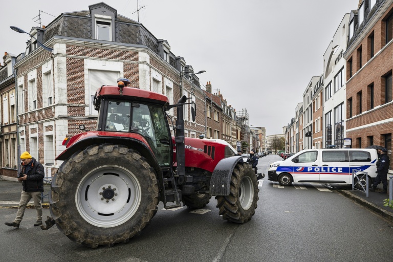 Macron meets French farmers in bid to defuse anger over trade deal